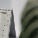 A close-up shot of a desk calendar open on March, with a soft, minimalistic background.